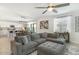 Spacious open-concept living room flowing into the dining area and modern kitchen at 9856 E Palladium Dr, Mesa, AZ 85212