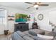 Comfortable living room with a large TV, stylish decor, and a gray sectional sofa at 9856 E Palladium Dr, Mesa, AZ 85212