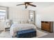 Serene main bedroom with elegant furnishings, including a plush bed, side tables, and soft lighting at 9856 E Palladium Dr, Mesa, AZ 85212