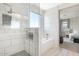 Modern shower with a glass door and an integrated bathtub with tiled walls at 9856 E Palladium Dr, Mesa, AZ 85212