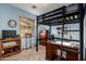Bedroom featuring a loft bed, a study desk, neutral colors, and ample natural light at 1022 N Kirby St, Gilbert, AZ 85234
