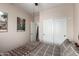 Bedroom with a ceiling fan, poster art, closet, and neutral colors providing a calming atmosphere at 1022 N Kirby St, Gilbert, AZ 85234