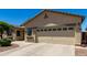 A well maintained single story house, featuring a large garage and a manicured front yard at 1022 N Kirby St, Gilbert, AZ 85234