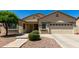 Charming single-story home featuring a well-manicured lawn and desert landscaping at 1022 N Kirby St, Gilbert, AZ 85234