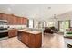 Stylish kitchen with granite countertops and tiled backsplash, open to the comfortable living area at 1022 N Kirby St, Gilbert, AZ 85234
