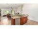 Modern kitchen with sleek countertops and cabinetry adjacent to a sunlit living space at 1022 N Kirby St, Gilbert, AZ 85234