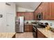 Well-appointed kitchen featuring stainless steel appliances and granite countertops at 1022 N Kirby St, Gilbert, AZ 85234