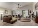 Spacious living room with vaulted ceiling, ceiling fan, and access to the backyard at 1022 N Kirby St, Gilbert, AZ 85234
