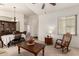 Inviting living room with neutral carpet, furniture, and an open doorway to other areas at 1022 N Kirby St, Gilbert, AZ 85234