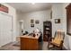 This office features bright walls, wood furniture, and unique decor, making it an inviting space for productivity at 1022 N Kirby St, Gilbert, AZ 85234