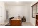 Bright office space with a large wooden desk and natural light from the window at 1022 N Kirby St, Gilbert, AZ 85234