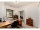 Office featuring a wood desk and shelves and a large window at 1022 N Kirby St, Gilbert, AZ 85234