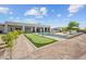 Backyard featuring a putting green, lounge area, and artificial turf at 10448 E Glencove St, Mesa, AZ 85207