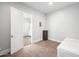 Neutral bedroom with carpeted floor, light walls, and open closet at 10448 E Glencove St, Mesa, AZ 85207