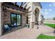 Inviting outdoor patio with comfortable seating, a pergola, and beautiful brick accents at 10448 E Glencove St, Mesa, AZ 85207