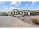 Beautiful exterior view of a single story home with a brick driveway and well-maintained landscaping at 10448 E Glencove St, Mesa, AZ 85207