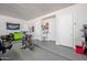 Well-lit garage with epoxy flooring and storage for your toys at 10448 E Glencove St, Mesa, AZ 85207