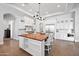 Gourmet kitchen featuring a large center island, stainless steel appliances, and ample cabinetry at 10448 E Glencove St, Mesa, AZ 85207