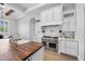 Chef's kitchen featuring a stainless steel range, custom cabinetry, and a center island at 10448 E Glencove St, Mesa, AZ 85207