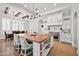 Well-appointed kitchen with an island, modern lighting, and stainless steel appliances at 10448 E Glencove St, Mesa, AZ 85207