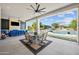 Covered patio with an outdoor dining and seating area, overlooking the pool at 10448 E Glencove St, Mesa, AZ 85207