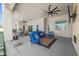 Spacious covered patio with blue furniture and ceiling fans at 10448 E Glencove St, Mesa, AZ 85207