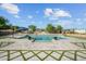 Resort-style pool area with a baja shelf, ample seating and lush landscaping at 10448 E Glencove St, Mesa, AZ 85207