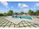 Stunning backyard pool features a geometric patio with artificial turf, fountains, and a built-in fire pit at 10448 E Glencove St, Mesa, AZ 85207