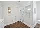 Bathroom featuring frameless shower, white walls and tile floors at 10448 E Glencove St, Mesa, AZ 85207