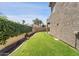 Spacious backyard features a well-maintained lawn and privacy wall offering a serene outdoor space at 10997 E Altadena Ave, Scottsdale, AZ 85259