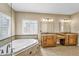 Spacious bathroom boasts dual sinks, granite counters, a soaking tub, and a separate shower at 10997 E Altadena Ave, Scottsdale, AZ 85259