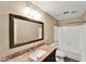 Bathroom featuring granite counters, shower-tub, and modern sink at 10997 E Altadena Ave, Scottsdale, AZ 85259