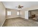 Spacious bedroom offers neutral carpeting, plantation shutters and ample closet space at 10997 E Altadena Ave, Scottsdale, AZ 85259