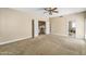 Bright bedroom with carpeting features an ensuite bathroom and access to upper level at 10997 E Altadena Ave, Scottsdale, AZ 85259