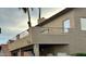 Lovely tan stucco home with iron railed patios, offering an inviting outdoor living space at 10997 E Altadena Ave, Scottsdale, AZ 85259