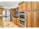 Gourmet kitchen offers stainless steel appliances, granite counters and ample cabinet space at 10997 E Altadena Ave, Scottsdale, AZ 85259