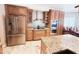 Well-equipped kitchen with stainless steel appliances, custom cabinetry, and granite countertops at 10997 E Altadena Ave, Scottsdale, AZ 85259