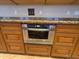 Modern built-in oven with custom cabinetry and convenient location in the kitchen at 10997 E Altadena Ave, Scottsdale, AZ 85259