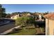 Scenic neighborhood view featuring lush landscaping, charming homes, and mountain vistas at 10997 E Altadena Ave, Scottsdale, AZ 85259