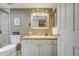 Beautiful bathroom featuring granite countertop, framed mirror, and tiled walk-in shower at 11144 N 109Th Way, Scottsdale, AZ 85259