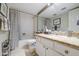 Bright bathroom features granite counters, a tub-shower combo, and a large mirror at 11144 N 109Th Way, Scottsdale, AZ 85259