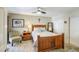Cozy bedroom with stylish furnishings, ceiling fan, wood-look flooring, and generous closet space at 11144 N 109Th Way, Scottsdale, AZ 85259