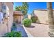 Private courtyard featuring desert landscaping and a covered entryway, perfect for outdoor relaxation and curb appeal at 11144 N 109Th Way, Scottsdale, AZ 85259