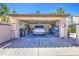 Well-organized two car garage with storage and a parked car at 11144 N 109Th Way, Scottsdale, AZ 85259