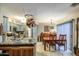 Well-equipped kitchen with stainless steel appliances and ample counter space, open to the dining area for easy entertaining at 11144 N 109Th Way, Scottsdale, AZ 85259