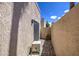 Outdoor patio area with privacy wall, paved floor, and outdoor AC unit at 11144 N 109Th Way, Scottsdale, AZ 85259