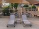 Comfortable lounge seating poolside with dining tables and chairs at 11144 N 109Th Way, Scottsdale, AZ 85259