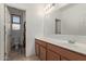 View of a bathroom with tile flooring, cabinets, sink, mirror and toilet at 11952 W Overlin Ln, Avondale, AZ 85323