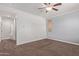 Bedroom with neutral walls and carpeting at 11952 W Overlin Ln, Avondale, AZ 85323