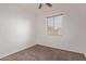 Bedroom with carpet flooring, a window, and white walls at 11952 W Overlin Ln, Avondale, AZ 85323